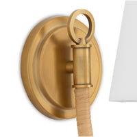 Treble Sconce Single: Brass wall sconce with a bent arm wrapped in natural bamboo and a white linen shade.