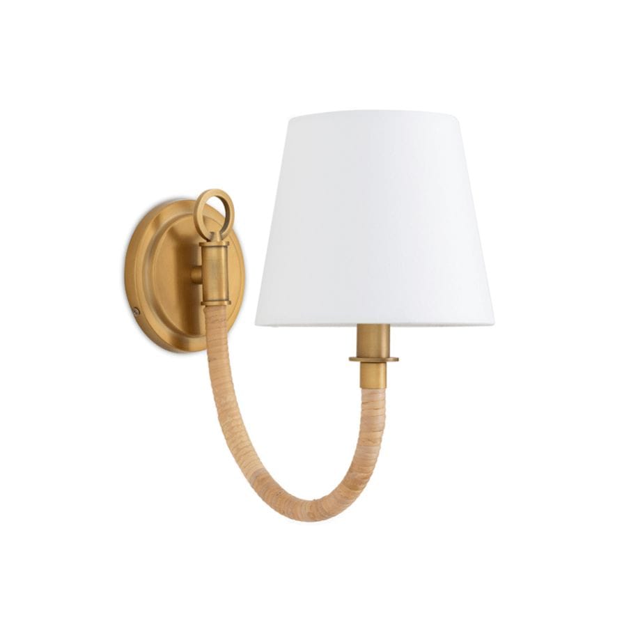 Treble Sconce Single: brass wall light with bent arm wrapped in natural bamboo, white linen shade.
