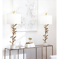 Pair of Trillium buffet lamps with antique gold leaf branches, white linen shades, and marble bases.