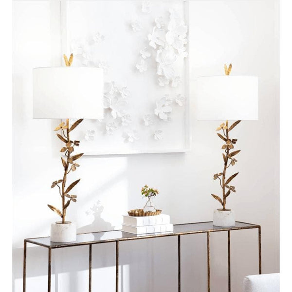 Pair of Trillium buffet lamps with antique gold leaf branches, white linen shades, and marble bases.