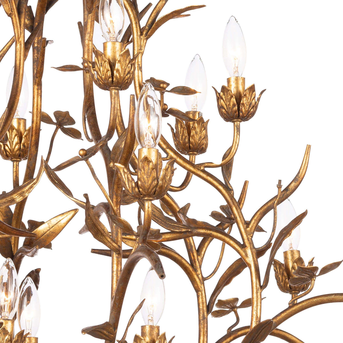 Trillium Chandelier: multi-tiered, antique gold leaf cast branches with candelabra bulbs.