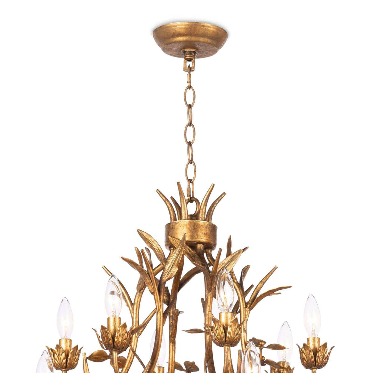 Trillium Chandelier: multi-tiered, antique gold leaf cast branches with 15 candelabra bulbs.