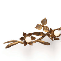 Trillium Sconce: Antique gold leaf cast branch sconce with five candelabra bulbs and floral details.