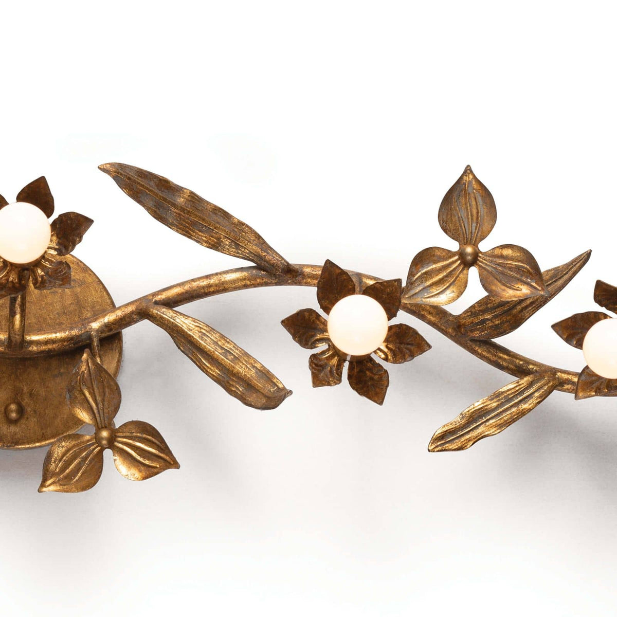 Trillium Sconce: Antique gold leaf sconce with five candelabra bulbs, featuring cast branches and floral details.