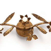 Trillium Sconce: Antique gold leaf cast branch design with five candelabra bulbs.