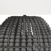 Tropez table lamp with distressed charcoal grey wooden beads and a white linen shade.