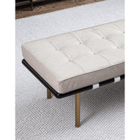 Tufted cappuccino leather gallery bench with black frame and gold legs on a white textured rug.