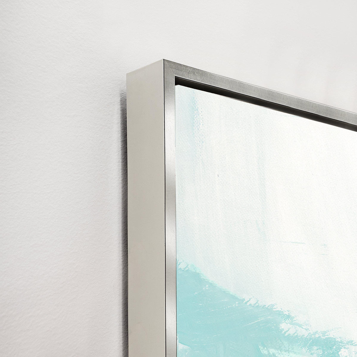 Close-up of Variance VI Giclee Canvas Painting, showing a silver floating frame and light blue brushstrokes.