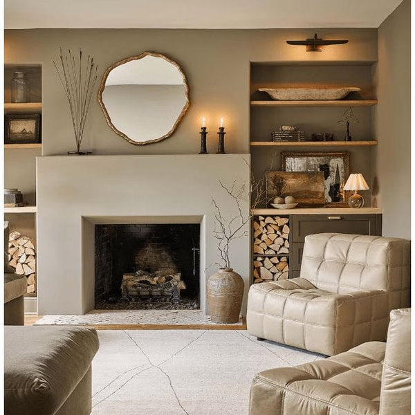 Vine Antique Gold Mirror with a textured, natural vine-inspired frame above a fireplace in a living room.