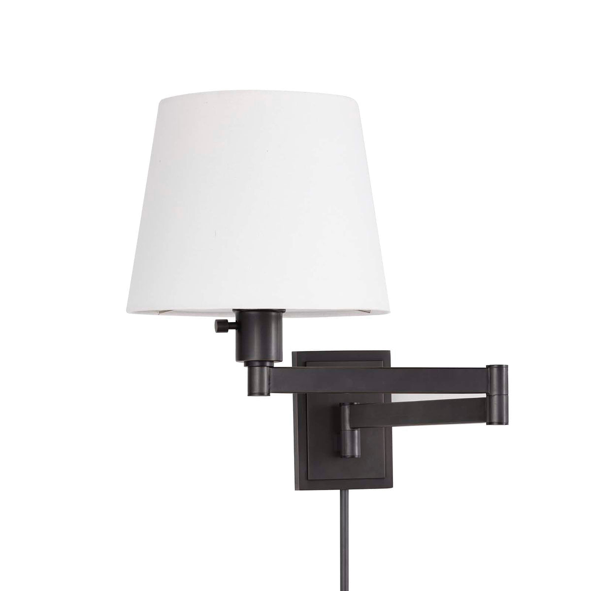 Virtue Sconce in oil rubbed bronze with an adjustable swing arm and white linen shade.