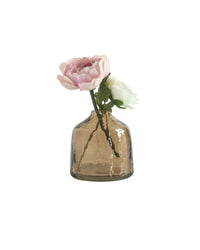 Smoked glass vase with a single pink flower on a white background