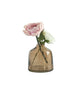 Smoked glass vase with a single pink flower on a white background
