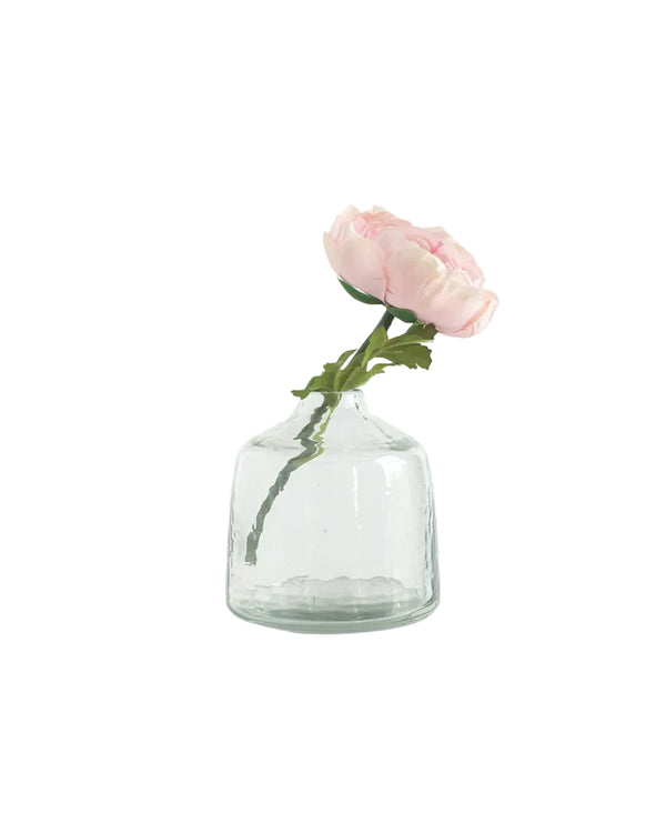 Clear glass vase with a single pink rose on a white background