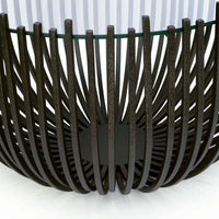 Sculpted webbed blackened iron coffee table with a glass top, 30" wide.