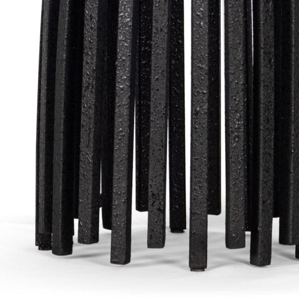 Close-up of the Webbed Table Lamp base, featuring sculpted blackened iron metal rods with a textured finish.