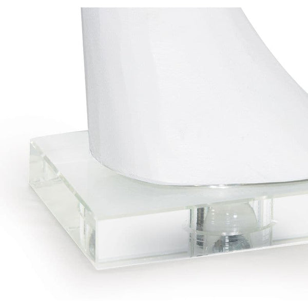 White resin whale tail tabletop accessory with a clear acrylic base.