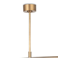 Wick Chandelier in natural brass with a modern, linear design and frosted acrylic bulb covers.