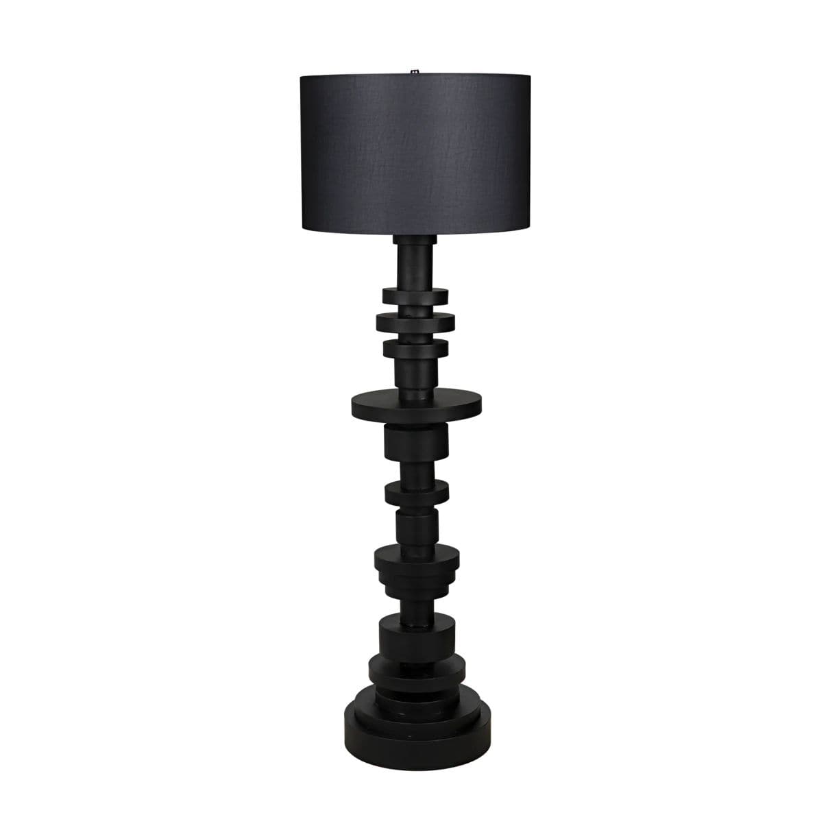 Wilton black steel floor lamp with stacked variegated metal discs base and a dark fabric drum shade.