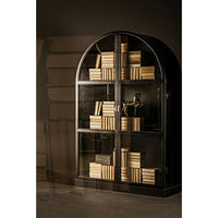 Black arched steel hutch with glass doors, filled with books and a decorative horse.