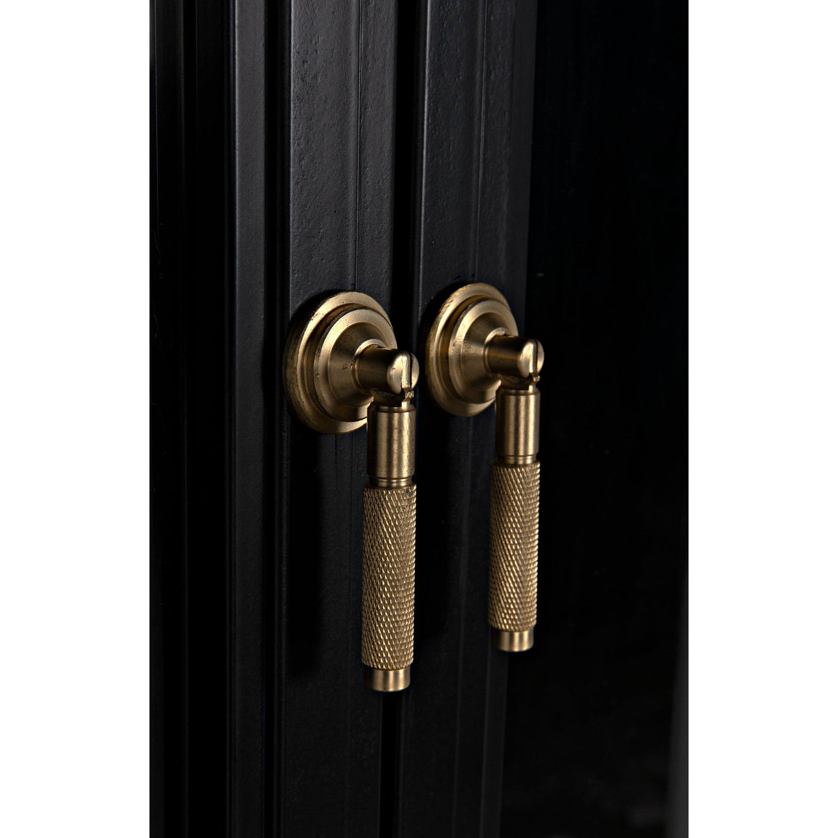 Close-up of Yoke Black Steel Arched Hutch with brass handles, showing detailed craftsmanship.