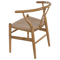 Natural sungkai wood dining chair with curved backrest and hand-carved details.