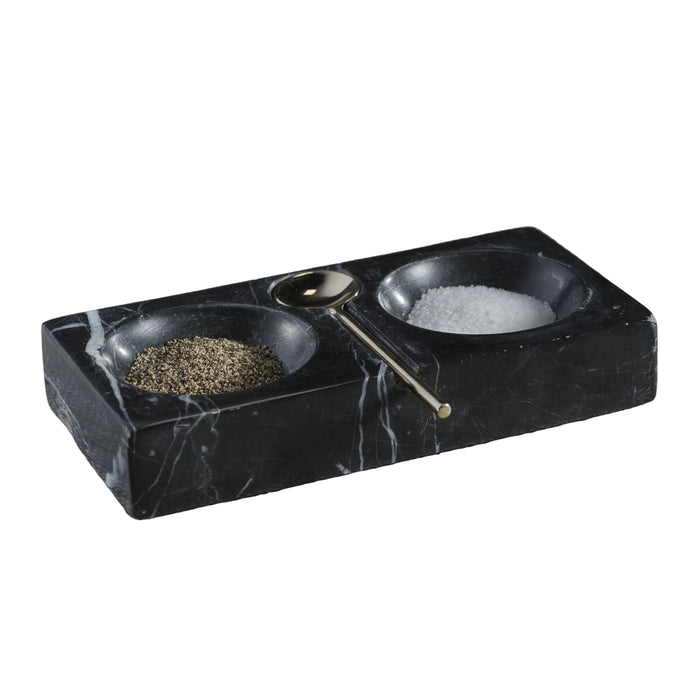 Black marble salt and pepper shaker set on a textured surface