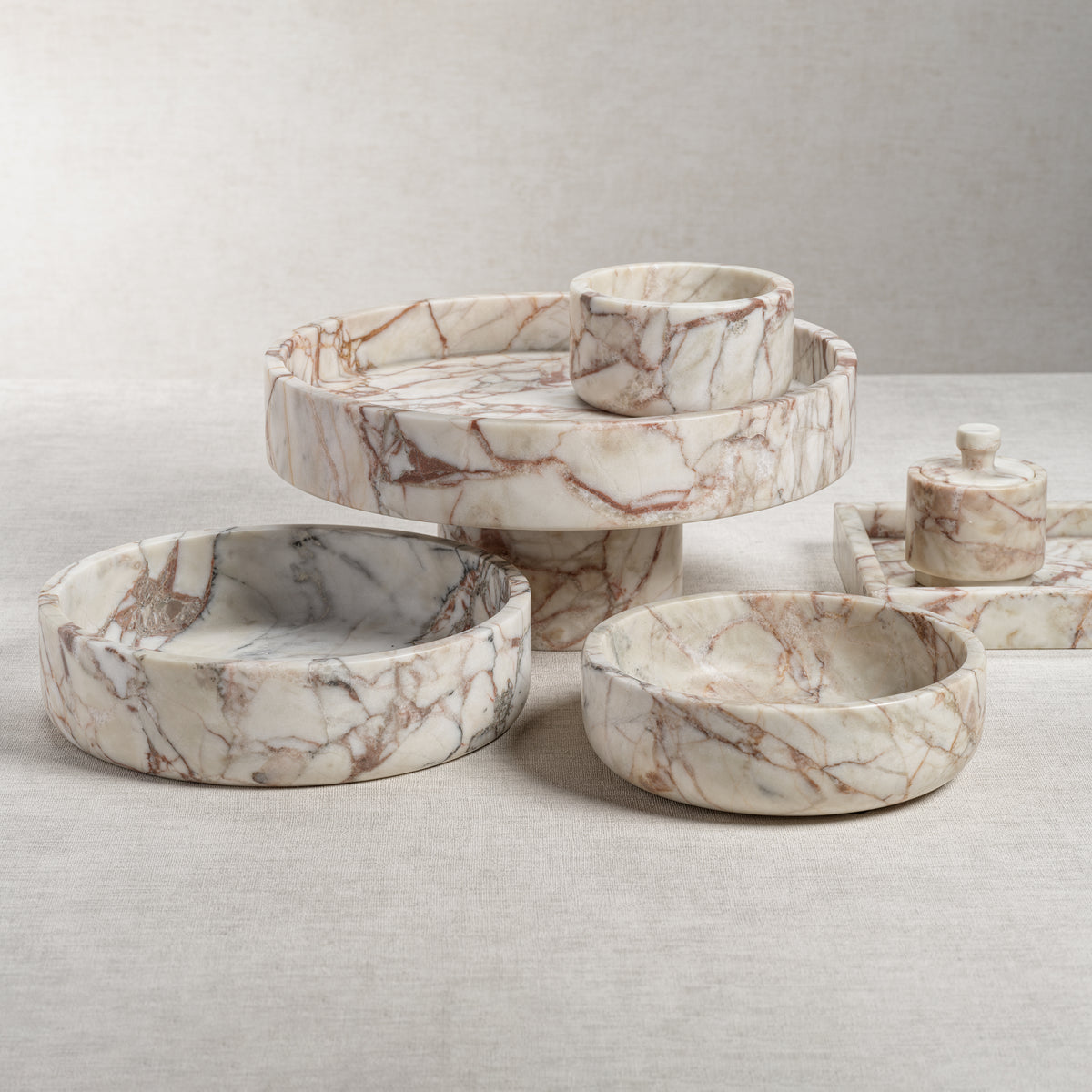 Set of marble-patterned bowls on a light gray surface