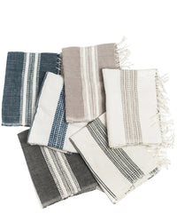 Set of striped towels in various colors on a white background